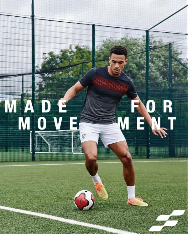 AI-generated apparel model sample: football kit on the pitch